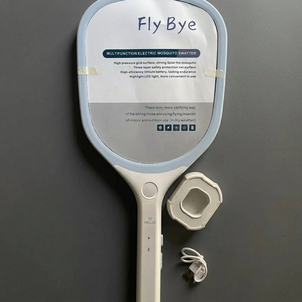 mosquito_swatter_lying_on_the_paper_box_with_stand_and_charging_cable