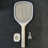 mosquito_swatter_laying_on_the_table_with_stand_and_charging_cable